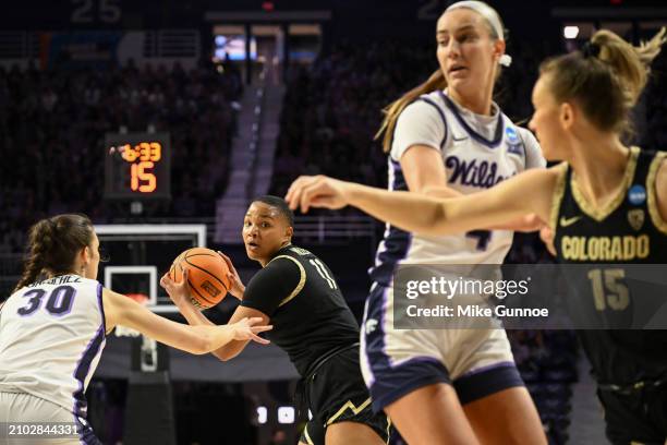 Quay Miller of the Colorado Buffaloes looks to pass the ball against Gisela Sanchez of the Kansas State Wildcats during the second round of the 2024...