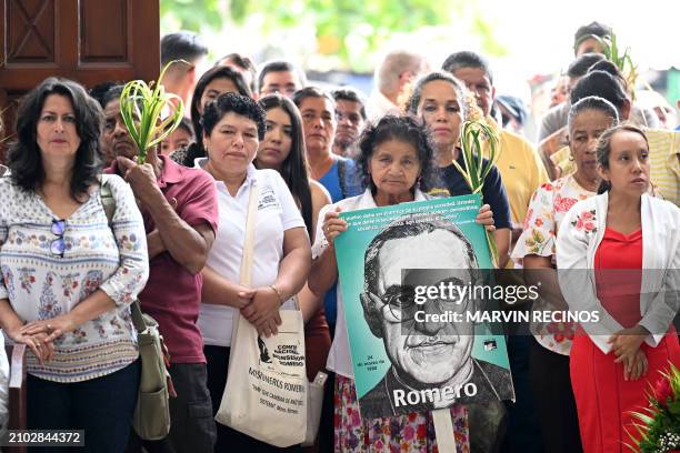 Catholic faithful attend a mass to commemorate the 44th anniversary of the assassination of Salvadoran Archbishop, Saint Oscar Arnulfo Romero , at...