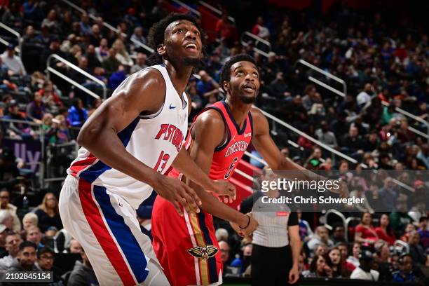 James Wiseman of the Detroit Pistons and Herb Jones of the New Orleans Pelicans box out during the game on March 24, 2024 at Little Caesars Arena in...