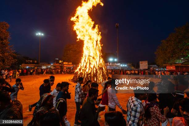 Devotees are performing the largest ''Holika Dahan'' as part of the Holi festival celebrations in a nearby village near Gandhinagar, the capital of...