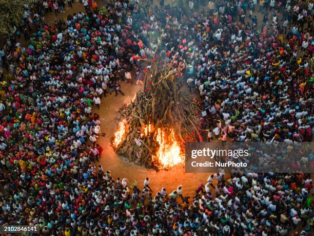 Devotees are performing the largest ''Holika Dahan'' as part of the Holi festival celebrations in a nearby village near Gandhinagar, the capital of...