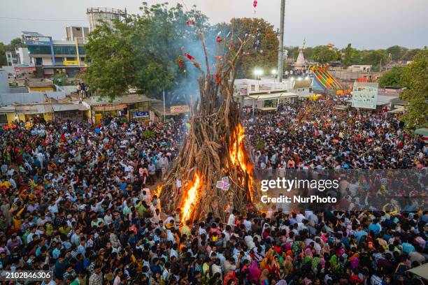 Devotees are performing the largest ''Holika Dahan'' as part of the Holi festival celebrations in a nearby village near Gandhinagar, the capital of...