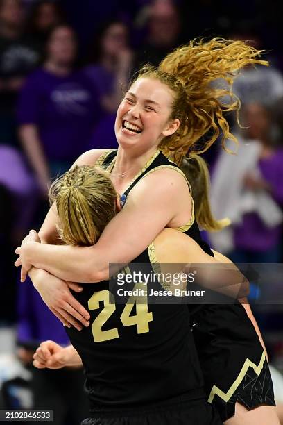 Frida Formann of the Colorado Buffaloes celebrates with Maddie Nolan of the Colorado Buffaloes after defeating the Kansas State Wildcats during the...