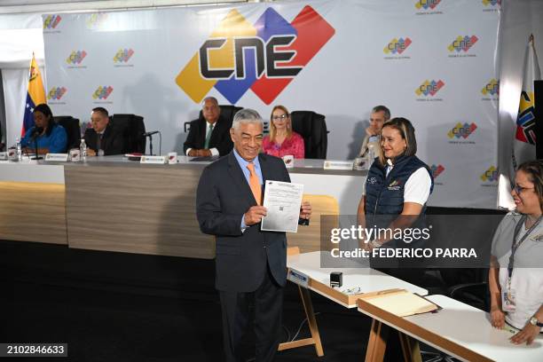 Claudio Fermin of the "Soluciones para Venezuela" political party submits his candidacy for the July 28 presidential election at the National...
