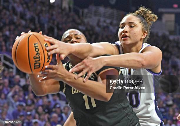 Ayoka Lee of the Kansas State Wildcats reaches in for the ball against Quay Miller of the Colorado Buffaloes in the second half during the second...