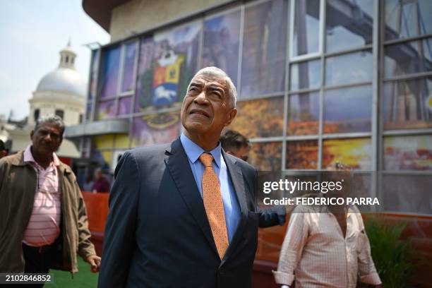 Claudio Fermin of the "Soluciones para Venezuela" political party leaves after submitting his candidacy for the July 28 presidential election at the...