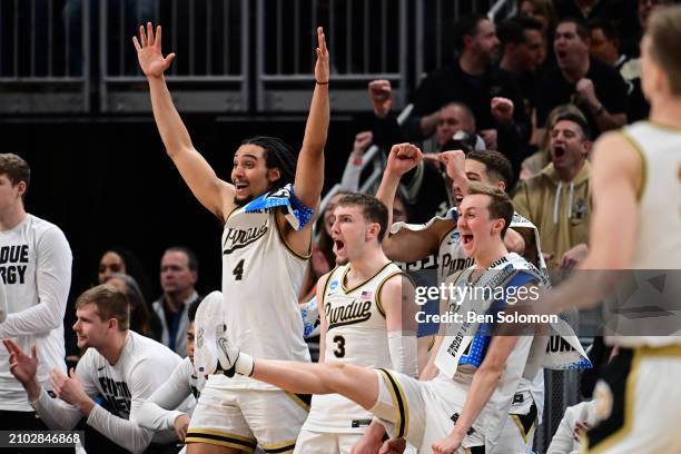 The Purdue Boilermakers bench celebrates a play against the Utah State Aggies during the second round of the 2024 NCAA Men's Basketball Tournament...