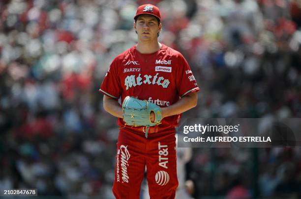 Mexico's Diablos Rojos pitcher Trevor Bauer gestures during the second inning of the first exhibition baseball game against New York Yankees at the...