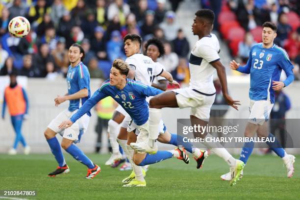 Italy's forward Nicolo Zaniolo heads the ball during the international friendly football match between Italy and Ecuador at Red Bull Arena in...