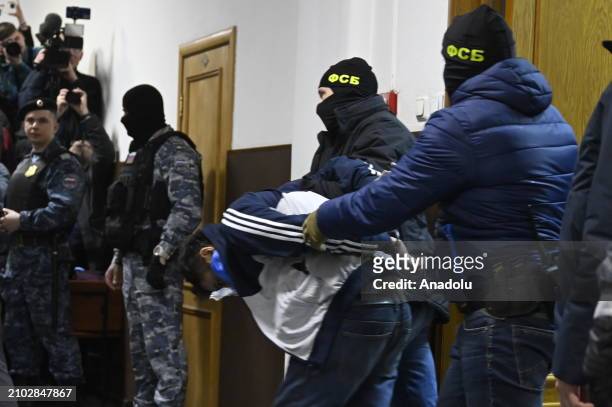 One of the suspects of the deadly terror attack on the Crocus City Hall is seen before appearing at the Basmanny District Court in Moscow, Russia on...