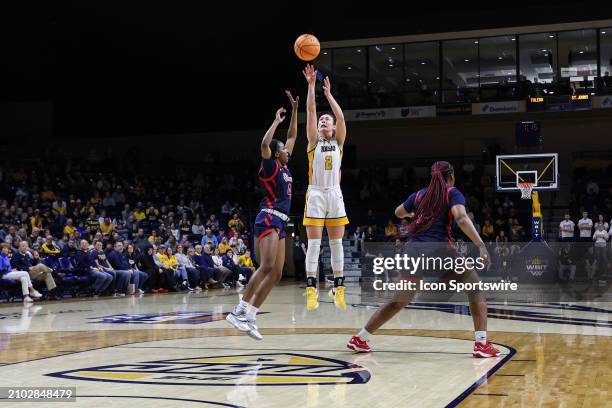 Toledo Rockets guard Sophia Wiard shoots a jump shot over St. John's Red Storm guard Skye Owen during the first quarter of a second round college...