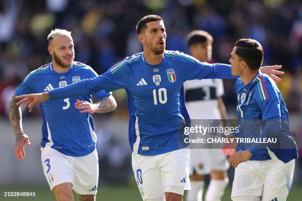 Italy's forward Lorenzo Pellegrini celebrates after scoring his team's first goal during the friendly football match between Italy and Ecuador at Red...