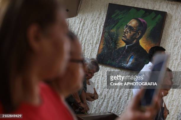 An artistic painting with Romero's face in front of people at a mass during the commemoration activities of the 44th Anniversary of the Assassination...