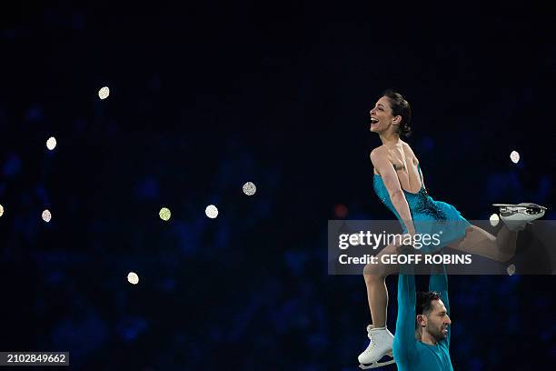 Deanna Stellato-Dudek and Maxime Deschamps of Canada perform during the Exhibition Gala of the International Skating Union World Figure Skating...