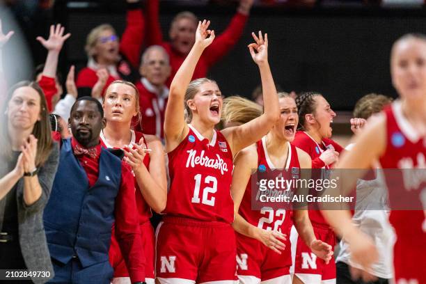 The Nebraska Cornhuskers bench react after a successful three-point shot was made during the second quarter of the 2024 NCAA Women's Basketball...