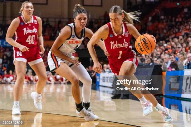 Guard Jaz Shelley of the Nebraska Cornhuskers dribbles the ball around guard Donovyn Hunter of the Oregon State Beavers during the first quarter of a...