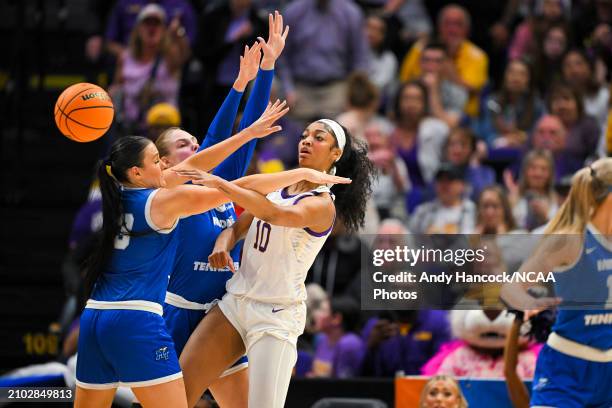 Angel Reese of the LSU Tigers passes the ball past Courtney Whitson of the Middle Tennessee Blue Raiders and Anastasiia Boldyreva of the Middle...