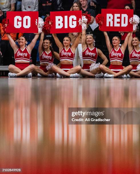 The Nebraska Cornhuskers cheerleading squad hold up signs during the fourth quarter of the 2024 NCAA Women's Basketball Tournament second round game...