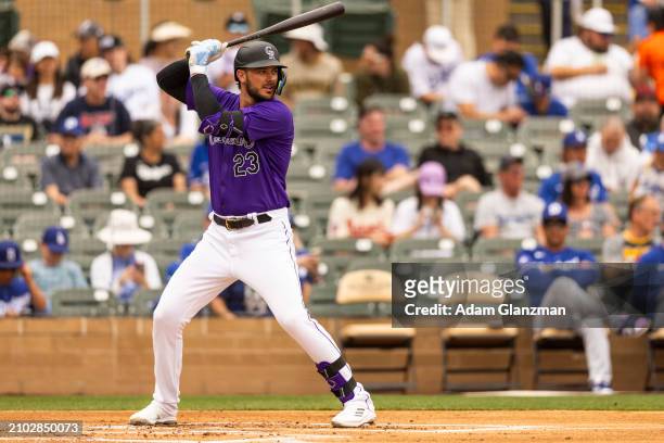Kris Bryant of the Colorado Rockies bats during the 2024 Spring Training Game between Los Angeles Dodgers and Colorado Rockies at Salt River Fields...