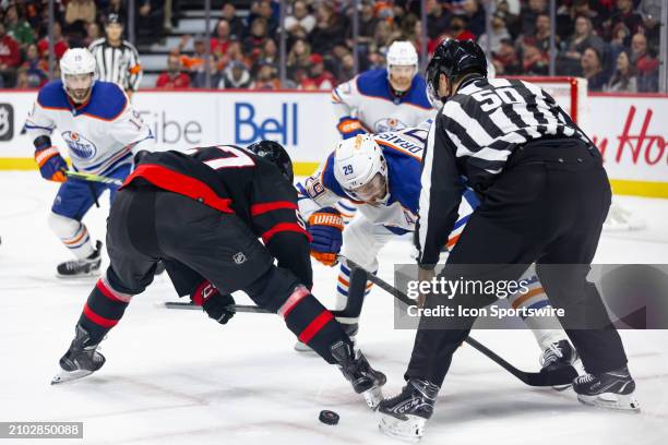 Edmonton Oilers Center Leon Draisaitl battles Ottawa Senators Center Shane Pinto on a face-off during first period National Hockey League action...