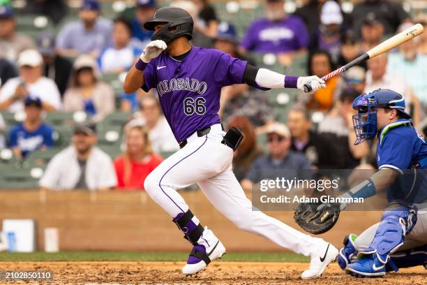 Bladimir Restituyo of the Colorado Rockies bats during the 2024 Spring Training Game between Los Angeles Dodgers and Colorado Rockies at Salt River...