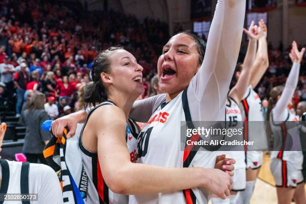 Guard AJ Marotte and forward Timea Gardiner of the Oregon State Beavers celebrate a 61-51 victory over the Nebraska Cornhuskers during a 2024 NCAA...