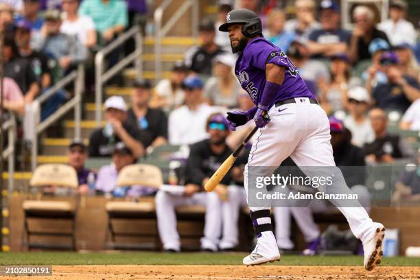 Elias Diaz of the Colorado Rockies bats during the 2024 Spring Training Game between Los Angeles Dodgers and Colorado Rockies at Salt River Fields on...