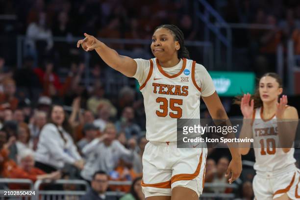 Texas Longhorns forward Madison Booker points at a teammate after an assist during the Texas Longhorns game versus the Alabama Crimson Tide in the...