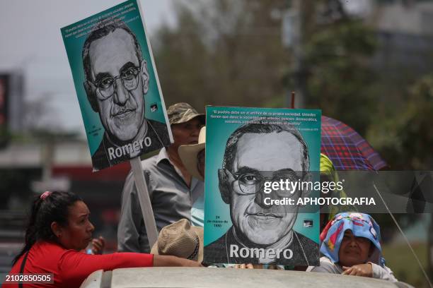 People carry posters of Romero during the commemoration activities of the 44th Anniversary of the Assassination of Archbishop Oscar Arnulfo Romero,...