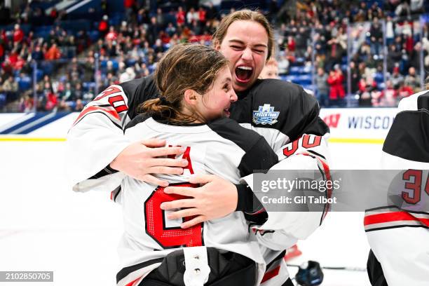 Amanda Thiele of the Ohio State Buckeyes celebrates with Hannah Bilka of the Ohio State Buckeyes after winning the Division I Women's Ice Hockey...