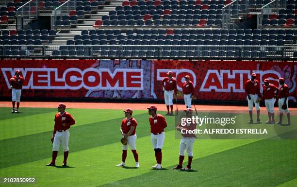 Mexico's Diablos Rojos baseball team players take part in a training session at the Alfredo Harp Helu Baseball Stadium in Mexico City on March 14,...