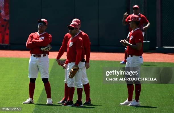 Mexico's Diablos Rojos baseball team players take part in a training session at the Alfredo Harp Helu Baseball Stadium in Mexico City on March 14,...