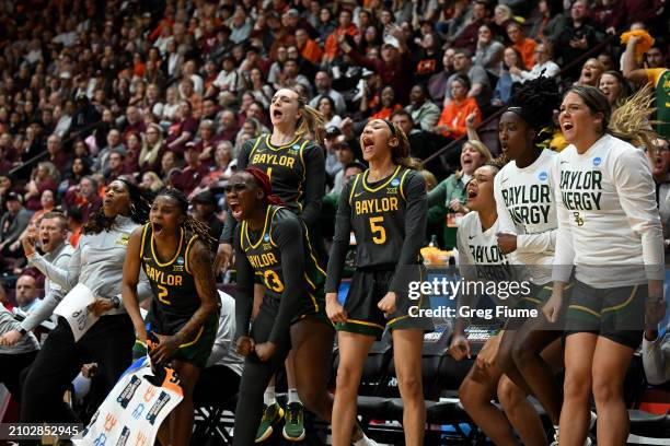 The Baylor Lady Bears bench celebrates during the fourth quarter against the Virginia Tech Hokies during the second round of the 2024 NCAA Women's...