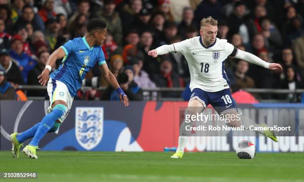 England's Jarrod Bowen and Brazil's Wendell during the international friendly match between England and Brazil at Wembley Stadium on March 23, 2024...