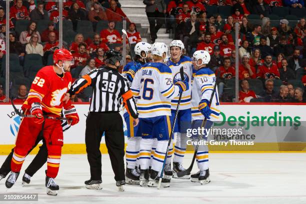 The Buffalo Sabres celebrate with teammates after scoring against the Calgary Flames at Scotiabank Saddledome on March 24, 2024 in Calgary, Alberta,...