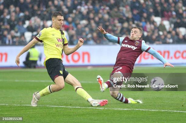 Burnley's Maxime Esteve and West Ham United's Jarrod Bowen during the Premier League match between West Ham United and Burnley FC at London Stadium...