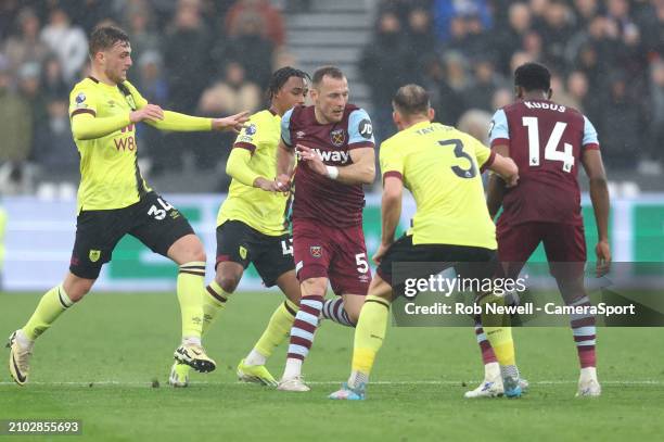 West Ham United's Vladimir Coufal gets in between Burnley's Jacob Bruun Larsen, Wilson Odobert and Charlie Taylor during the Premier League match...