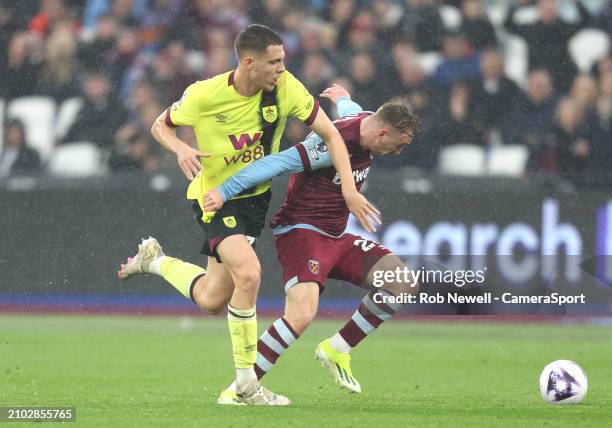 West Ham United's Jarrod Bowen is challenged by Burnley's Maxime Esteve during the Premier League match between West Ham United and Burnley FC at...