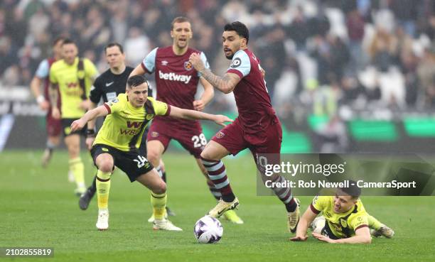 West Ham United's Lucas Paqueta gets in between Burnley's Maxime Esteve and Josh Cullen during the Premier League match between West Ham United and...