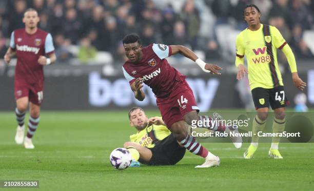 West Ham United's Mohammed Kudus gets away from Burnley's Charlie Taylor during the Premier League match between West Ham United and Burnley FC at...