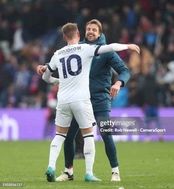 Luton Town's Cauley Woodrow and Tim Krul celebrate at the final whistle during the Premier League match between Crystal Palace and Luton Town at...
