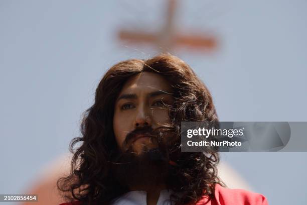 Young man is dressed as Jesus Christ on the streets of Culhuacan in the southern end of Mexico City, representing the Passion of Christ as part of...