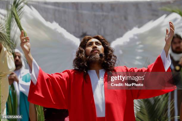 Young man is dressed as Jesus Christ on the streets of Culhuacan in the southern end of Mexico City, representing the Passion of Christ as part of...