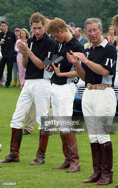 British Prince William brother Prince Harry and their father prince Charles, The prince of Wales applaud Harry recieving his prize at the end of the...