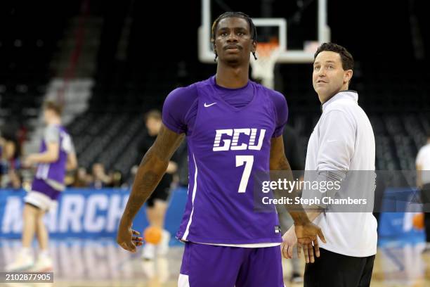 Head coach Bryce Drew of the Grand Canyon Antelopes and Tyon Grant-Foster look on during practice ahead of the first and second rounds of the NCAA...