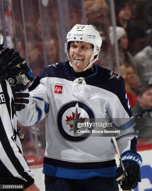 Nikolaj Ehlers of the Winnipeg Jets celebrates his second period goal against the New Jersey Devils at Prudential Center on March 21, 2024 in Newark,...