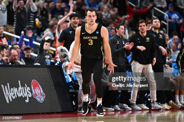 Jack Gohlke of the Oakland Golden Grizzlies reacts after making a three pointer against the Kentucky Wildcats during the second half in the first...