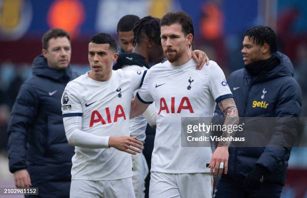 Pedro Porro and Pierre-Emile Hojbjerg of Tottenham Hotspur embrace following the Premier League match between Aston Villa and Tottenham Hotspur at...