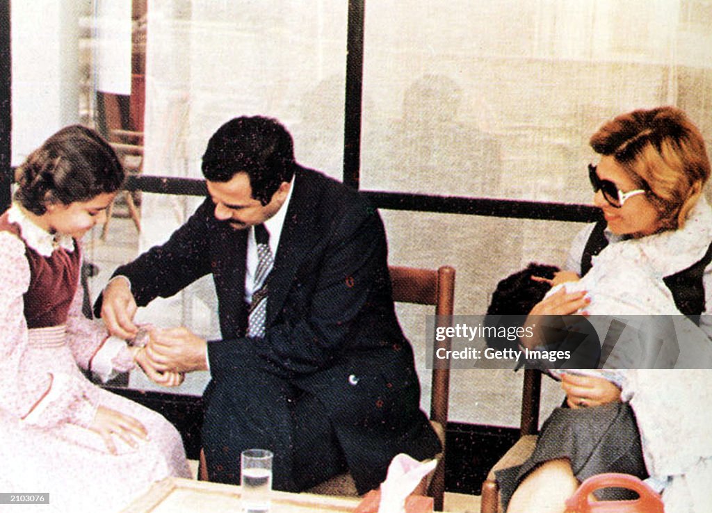 In This Undated Photo Saddam Hussein Helps His Daughter Ragad As in-this-undated-photo-saddam-hussein-helps-his-daughter-ragad-as