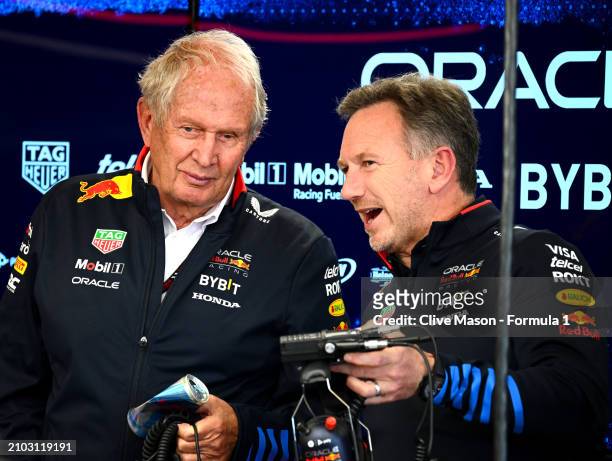 Oracle Red Bull Racing Team Consultant Dr Helmut Marko and Oracle Red Bull Racing Team Principal Christian Horner talk in the garage during practice...